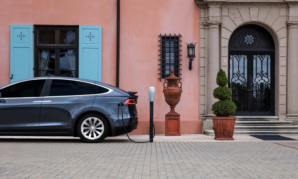 Tesla Model X connected to Gen 2 Wall Connector at hotel-style property